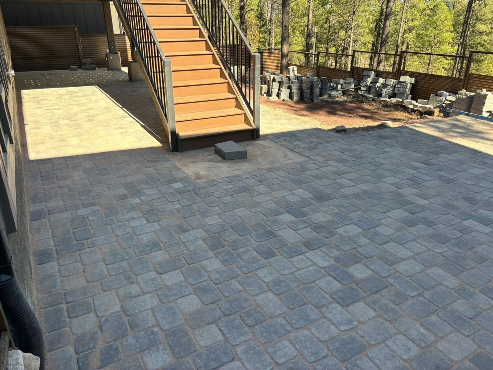 Large paver patio with staircase